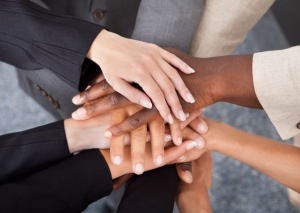 Multiracial Businesspeople Stacking Hands Design